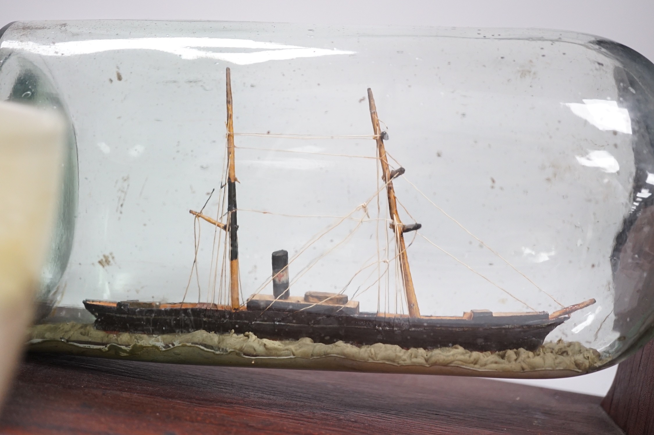A Royal Doulton series ware bowl, a ship in a bottle and a Gordon Highlanders white metal mounted swagger stick